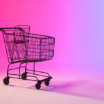 Shopping,Trolley,With,Copy,Space,Over,Neon,Purple,Background.,Cyber