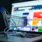 Small,Shopping,Cart,On,A,Laptop,Keyboard,Signifies,Convenience,In