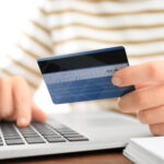 Woman,With,Credit,Card,And,Laptop,At,Table,,Closeup.,Internet