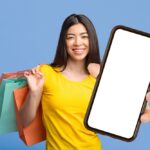 Online,Shopping,App.,Smiling,Asian,Woman,Holding,Smartphone,With,Black