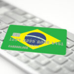 Plastic,Bank,Card,Depicting,Flag,Of,Brazil,On,Computer,Keyboard.